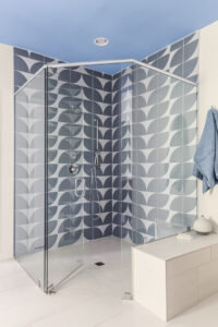 curbless shower with flower petal tile