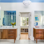 renovated master bath with dual vanities curbless shower and freestanding tub