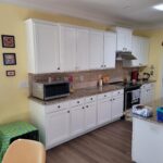 Before - white cabinets and granite