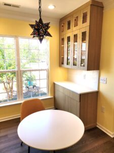 Shiloh frameless cabinets in tea-seating niche