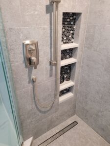 Four-compartment recessed shower niche